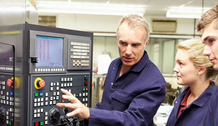 Students being shown how to use equipment